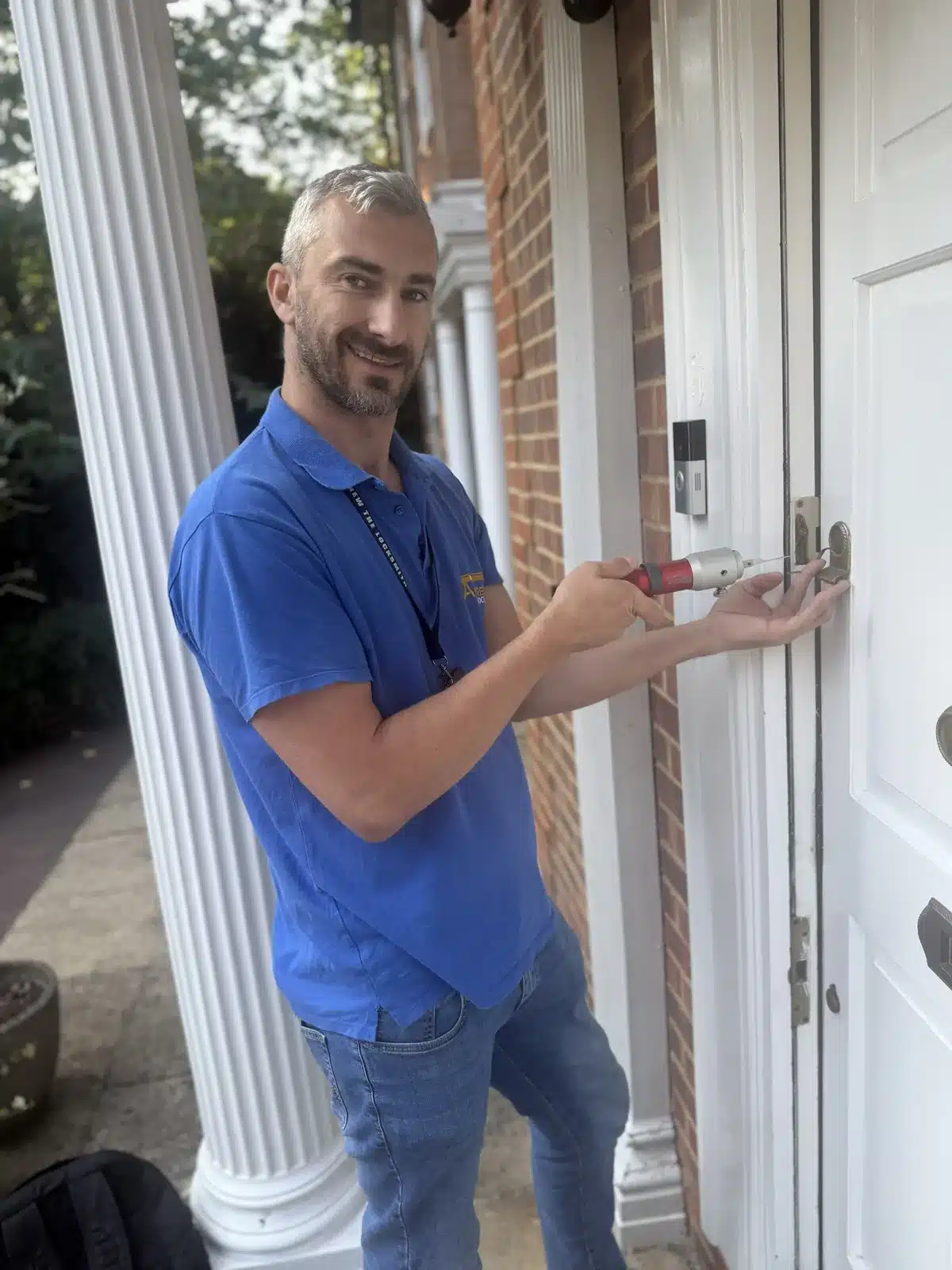 Andrew the Locksmith working on a front door lock with a pick gun in Harrow