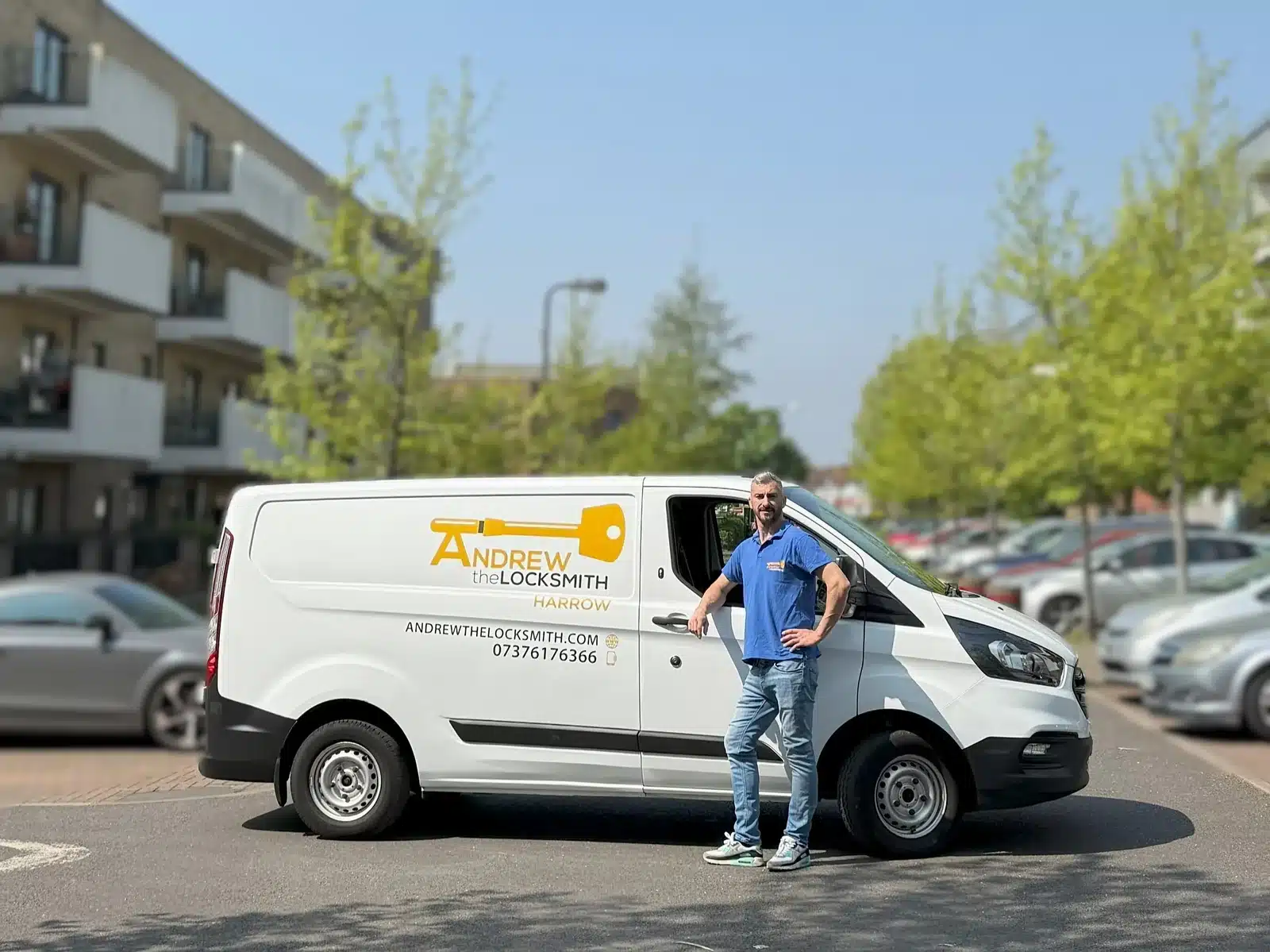 Andrew the Locksmith standing beside his branded van in Harrow