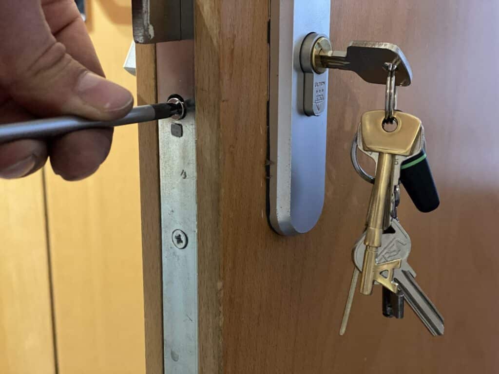 Andrew fitting an Ultion anti-snap 3-star euro cylinder on a door in Harrow