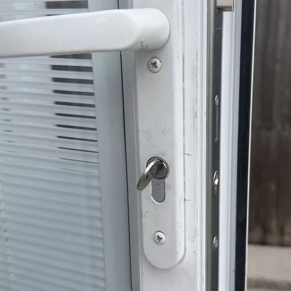 Worn basic euro cylinder on a uPVC door before upgrade