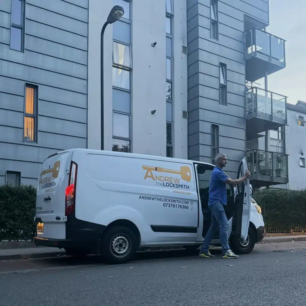 Andrew the Locksmith at his open van door at dusk, heading out on an emergency call-out in Harrow