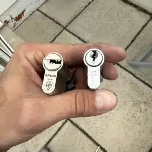 Old basic euro cylinder next to a new 3-star anti-snap cylinder