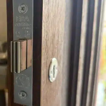BSI kitemark and BS3621 stamp on the faceplate of an ERA mortice lock on a timber door
