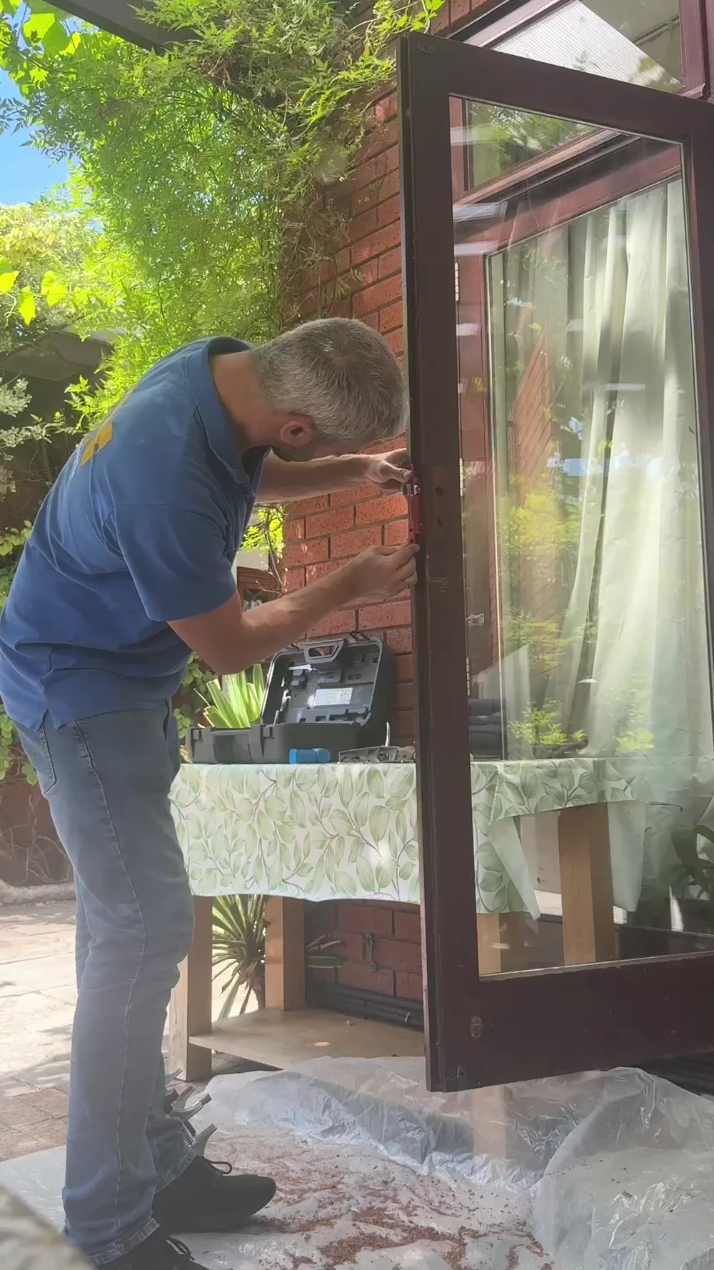 Andrew fitting the new mortice lock into the door in Harrow