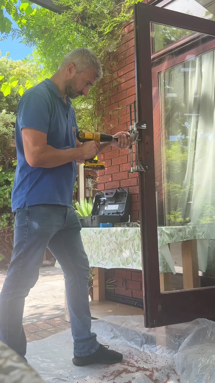 Andrew morticing a door, drilling out the pocket for a new mortice lock in Harrow