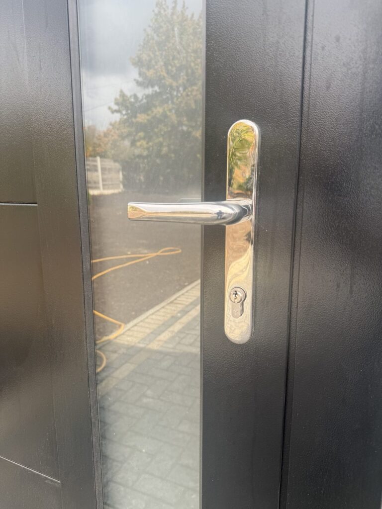 Before: old keyed multipoint handle on a front door in Harrow, ready for a smart lock upgrade
