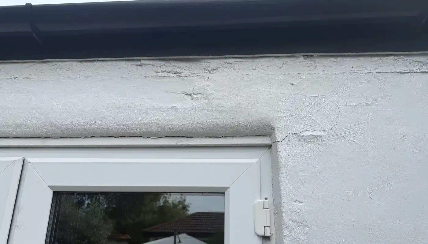 Crack running out of the top corner of a French door on a single storey extension