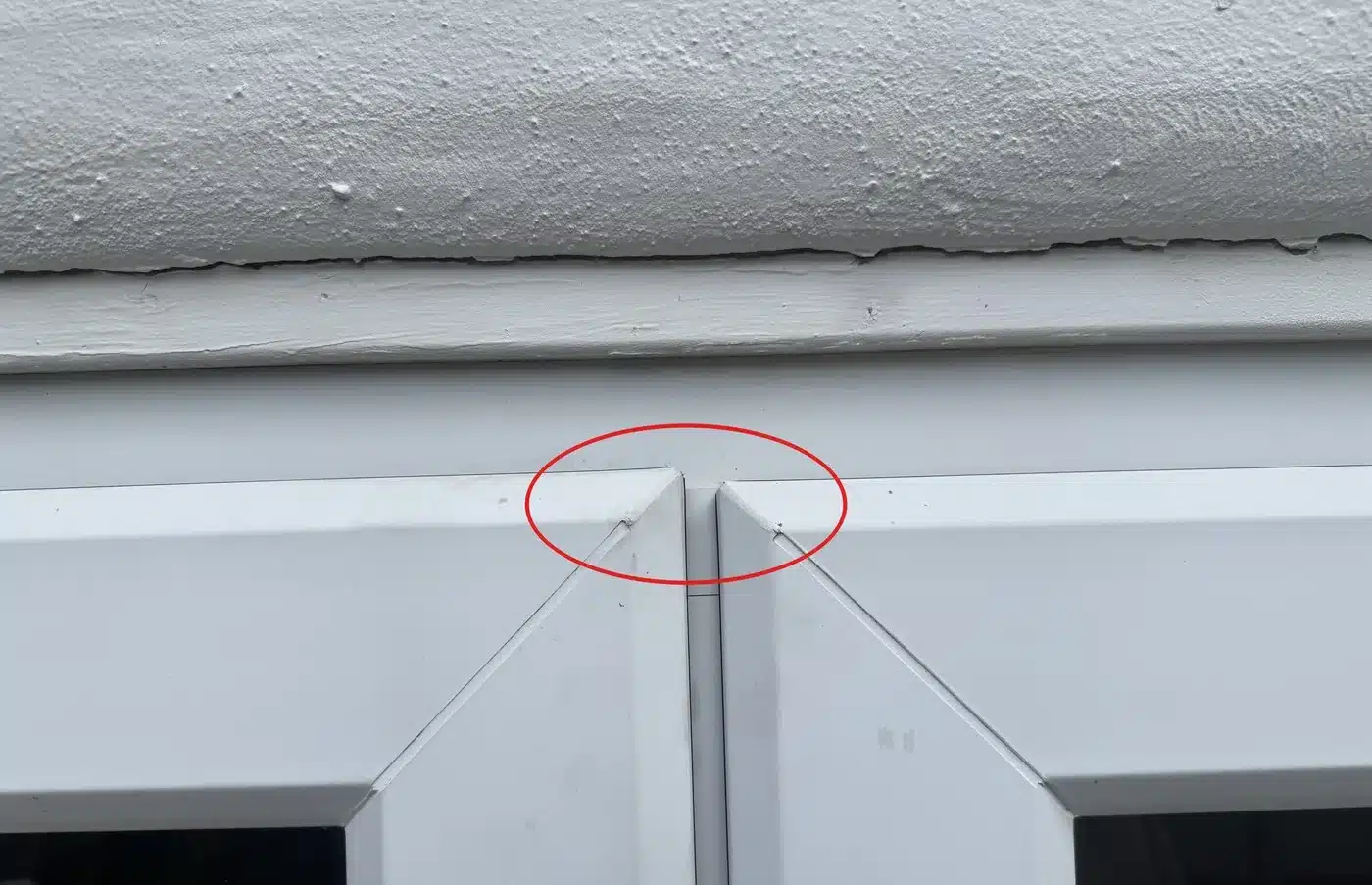 The two door leaves no longer sitting level with each other at the top